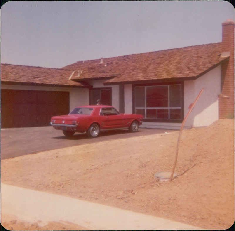 The car in it’s original Candy Apple Red with my mother (the very first owner) in the background